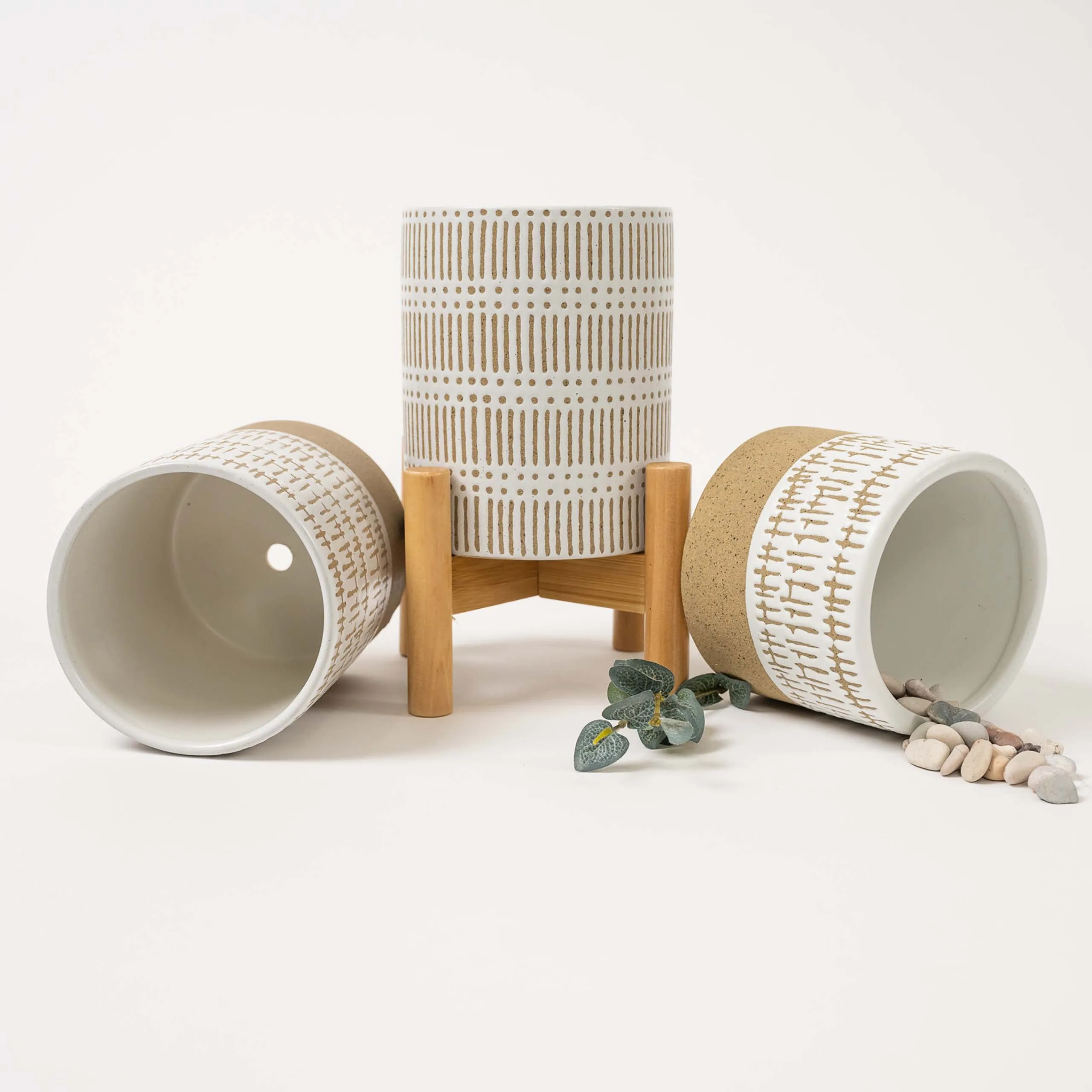 SET OF THREE SMALL STONEWARE POTS WITh STANDS - The large pots are 5.75" high.  The small pot is3.5" high. All three have a stand